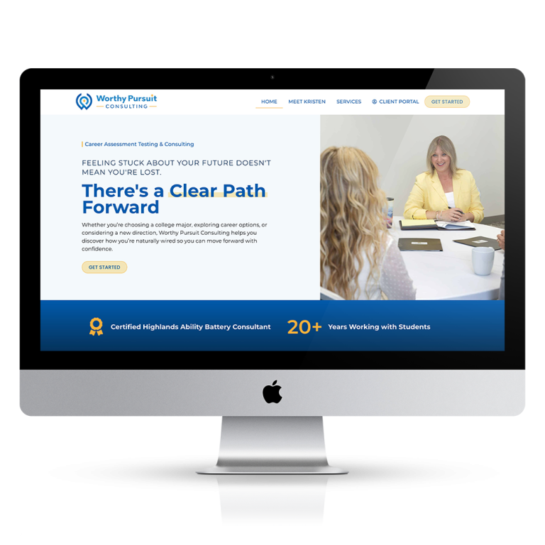 A computer screen displays the Kalamazoo Web Design LLC consulting website, with two women talking at a table on the right.